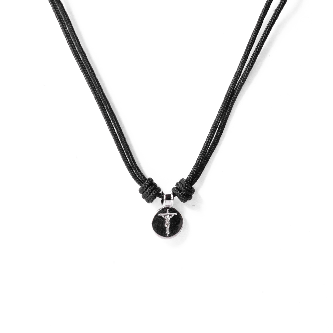 Round crucifix medal in cord