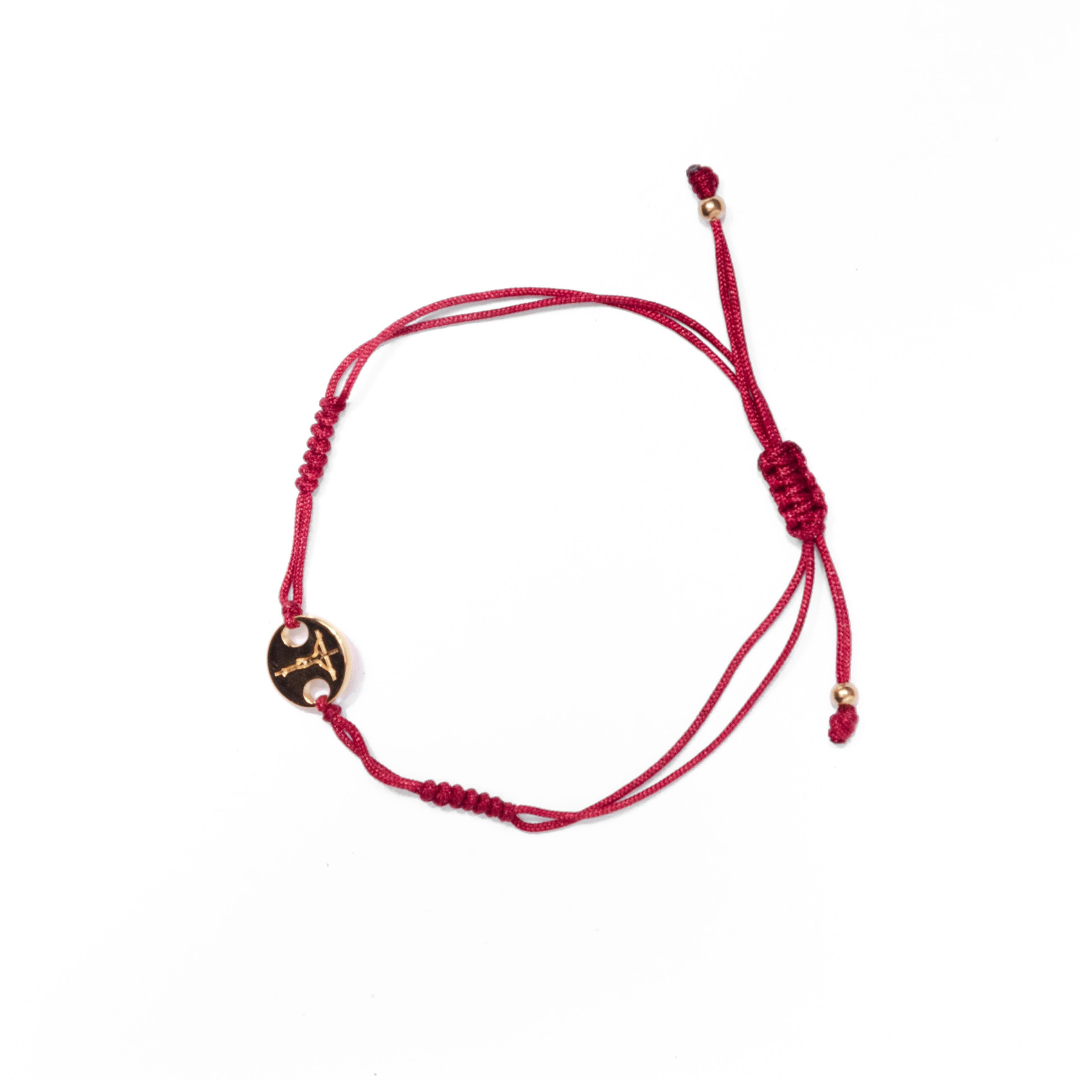 Crucifix woven bracelet