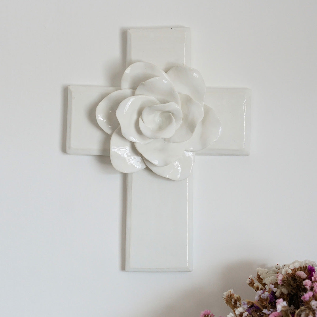 Ceramic cross with flower in the center
