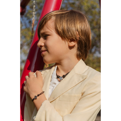 Smooth silver cross in cord