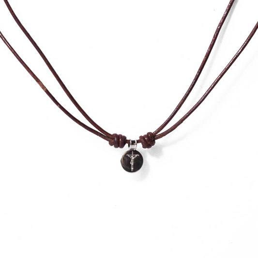Round crucifix medal in cord