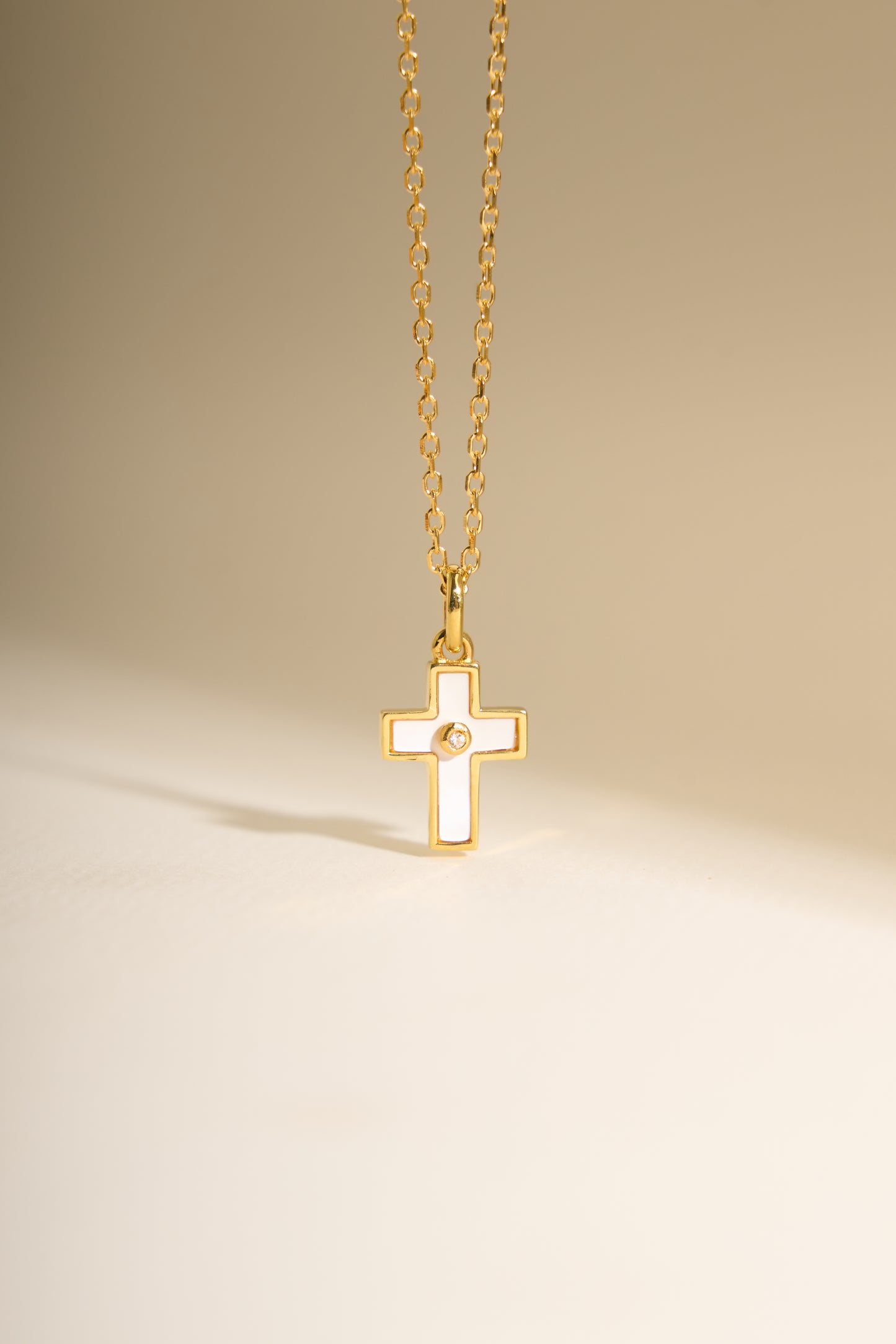 Mother of pearl cross with zirconia