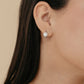 Aretes arracada de rodio tipo huggies con Solitaire Halo de Moissanita de 0.5 ct