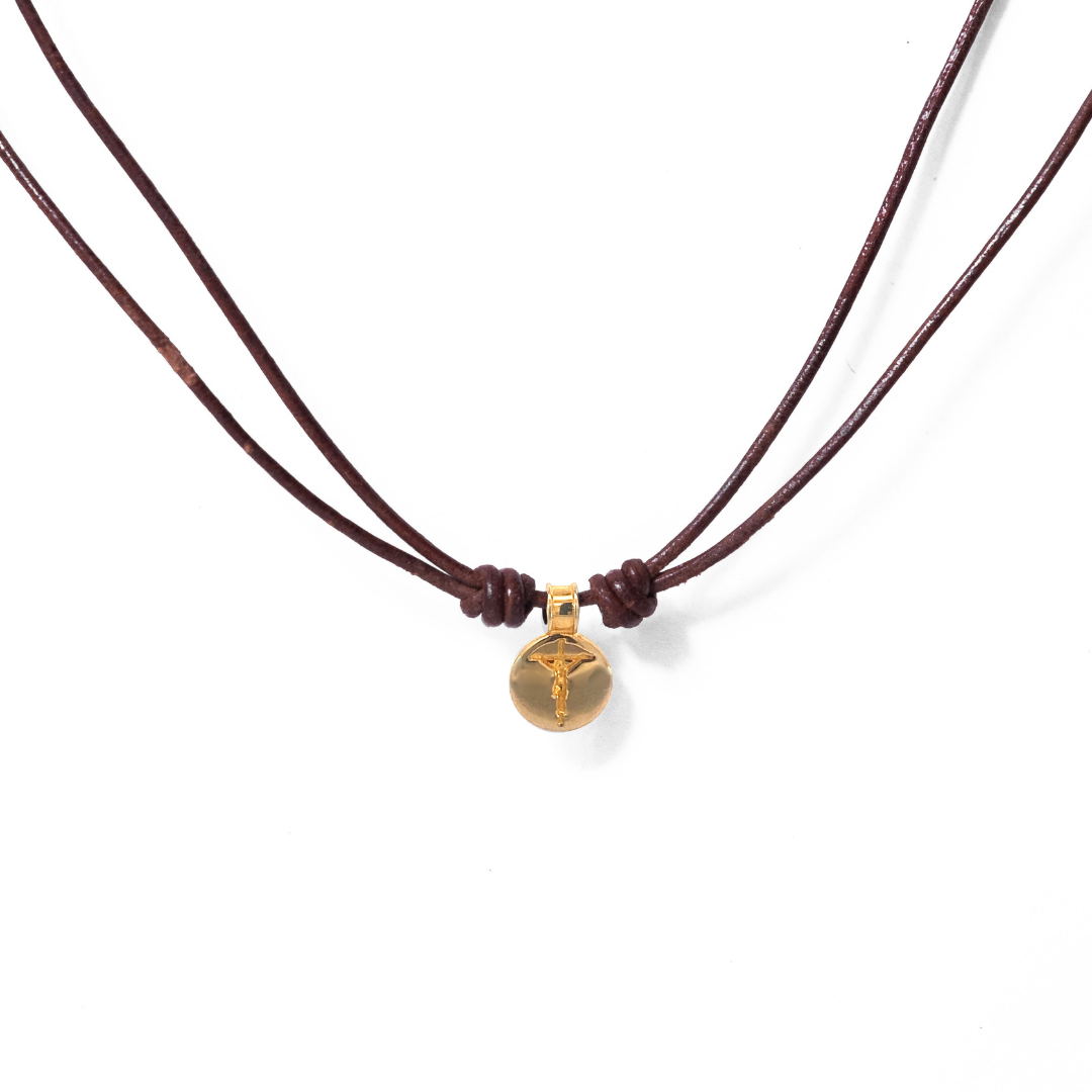 Round crucifix medal in cord