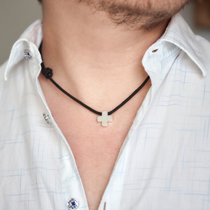 Smooth silver cross in cord